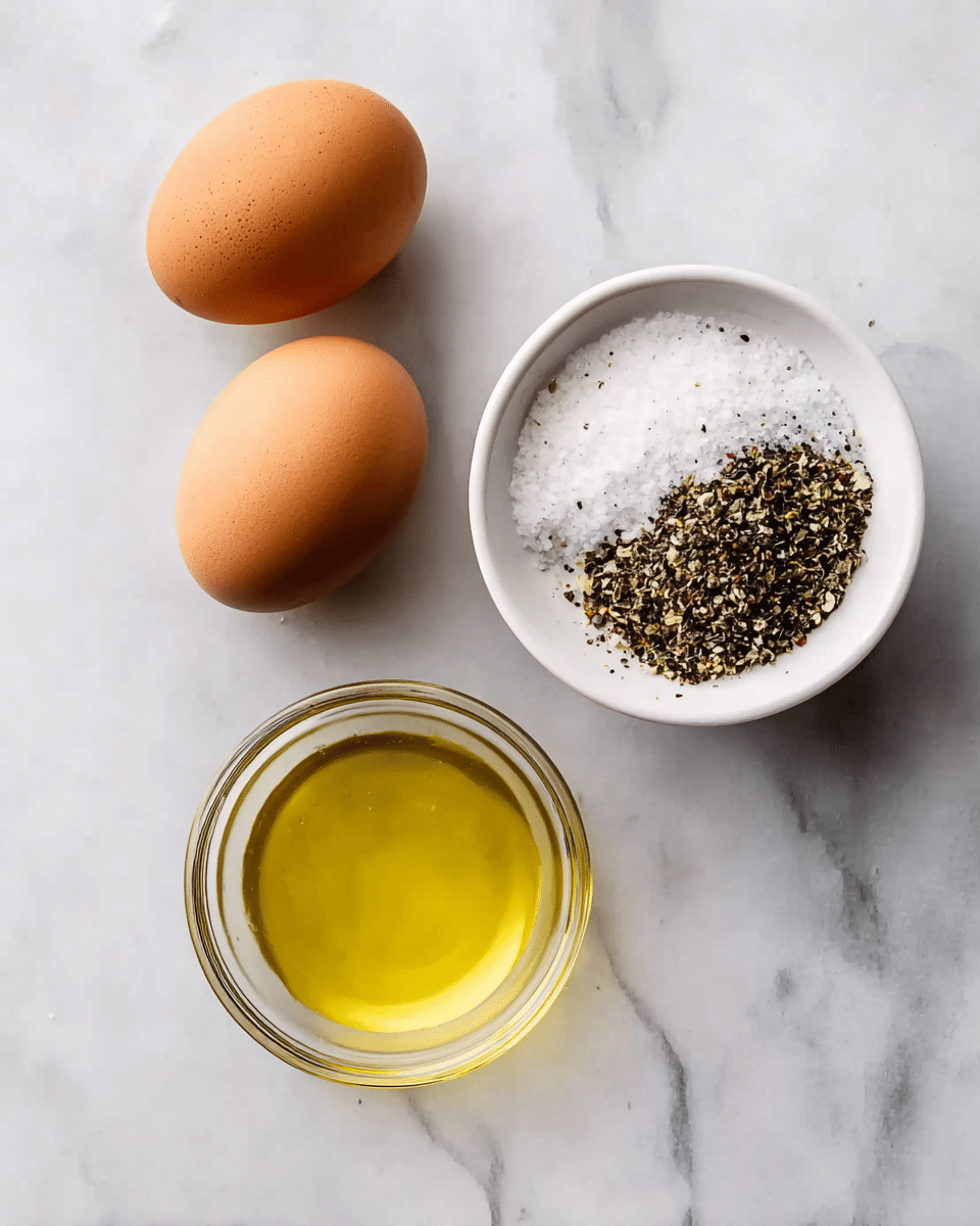 The image shows three groups of ingredients on a white marbled surface. At the top, there are two brown eggs laying side by side with smooth shells. Below the eggs, there is a small clear glass bowl filled with light yellow oil, its surface looks shiny and smooth. To the right and slightly below the bowl, there is a white bowl holding two distinct piles: one side has coarse white salt and the other side has crushed black pepper. The composition is simple with each item clearly visible and spaced apart. photo taken with an iphone --ar 4:5 --v 7