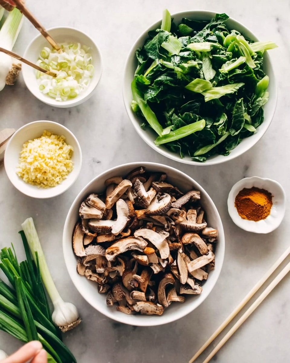 The image shows four white bowls placed on a white marbled surface. The largest bowl at the bottom center is full of sliced brown mushrooms with a rough texture. Above it to the right, there is a medium white bowl filled with bright green leafy vegetables that are torn into large pieces. To the left of the green vegetable bowl, there is a smaller white bowl containing finely chopped light yellow garlic. Below it, there is another small white bowl with a mound of orange-brown spice powder. In the lower-left corner, there are some fresh chopped green onions on the white marble surface. A woman's hand is holding a pair of light-colored chopsticks near the top left corner. Photo taken with an iphone --ar 4:5 --v 7