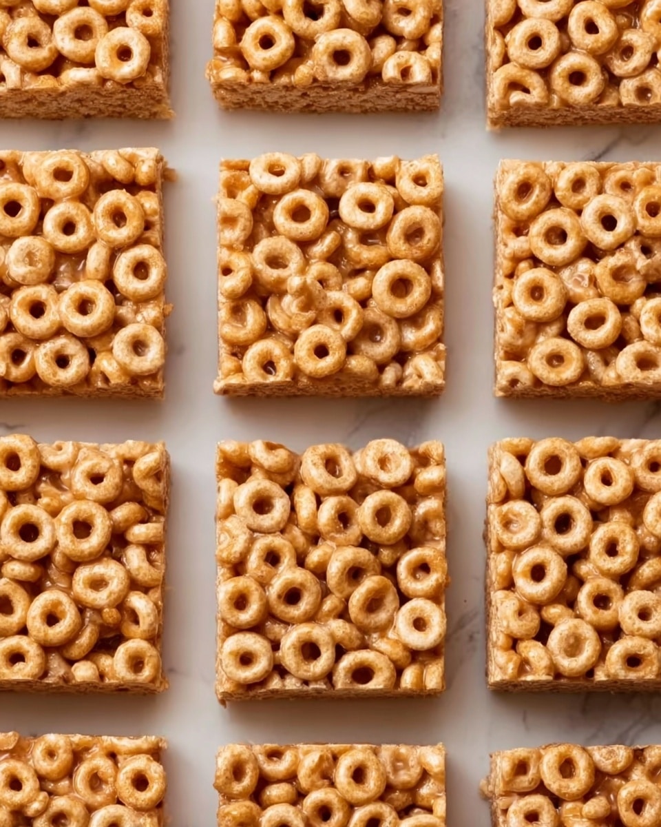 The image shows nine square cereal bars arranged in a grid on a white marbled surface. Each bar is made of small round cheerio-like cereal pieces tightly packed and bound together by a shiny, light brown sticky layer. The-bars have a slightly rough texture with the cereal rings clearly visible on top, giving a crunchy appearance. The colors are mainly light golden brown with slight variations in shading from the sticky binder. Photo taken with an iphone --ar 4:5 --v 7