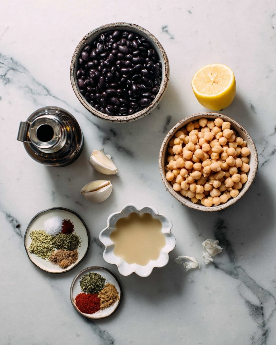 The image shows several ingredients arranged on a white marbled surface. At the top left, there is a round bowl filled with dark black beans, and below it slightly to the right, there is a round bowl filled with light beige chickpeas. To the right of the bowls, there is a halved lemon with a bright yellow inside and two small garlic cloves beside it. Below these, there is a small white scalloped bowl containing a smooth, light beige liquid. Toward the bottom left corner, there is a small round plate with various spices including a red powder, green herbs, salt, and brown powder. Near the bottom left, there is a dark bottle with a metal pour spout. The entire setup is neatly spaced on the white marbled surface, creating a clean and organized look. Photo taken with an iphone --ar 4:5 --v 7