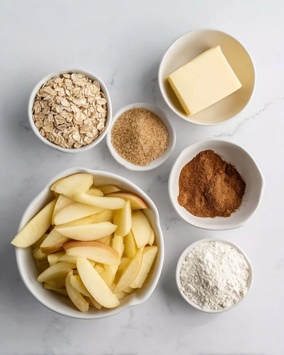 The image shows six white bowls on a white marbled surface, each holding different ingredients for baking. The largest bowl at the bottom left is filled with sliced pale yellow apples. To the right of the apples, a small bowl contains a solid pale yellow cube of butter. Above the butter, another small bowl holds light brown brown sugar. To the left of the brown sugar, a small bowl is filled with beige rolled oats. Above the oats, there is a tiny bowl with reddish-brown cinnamon powder. On the right bottom corner, a tiny bowl contains white flour. The overall look is clean, organized, and simple. Photo taken with an iphone --ar 4:5 --v 7