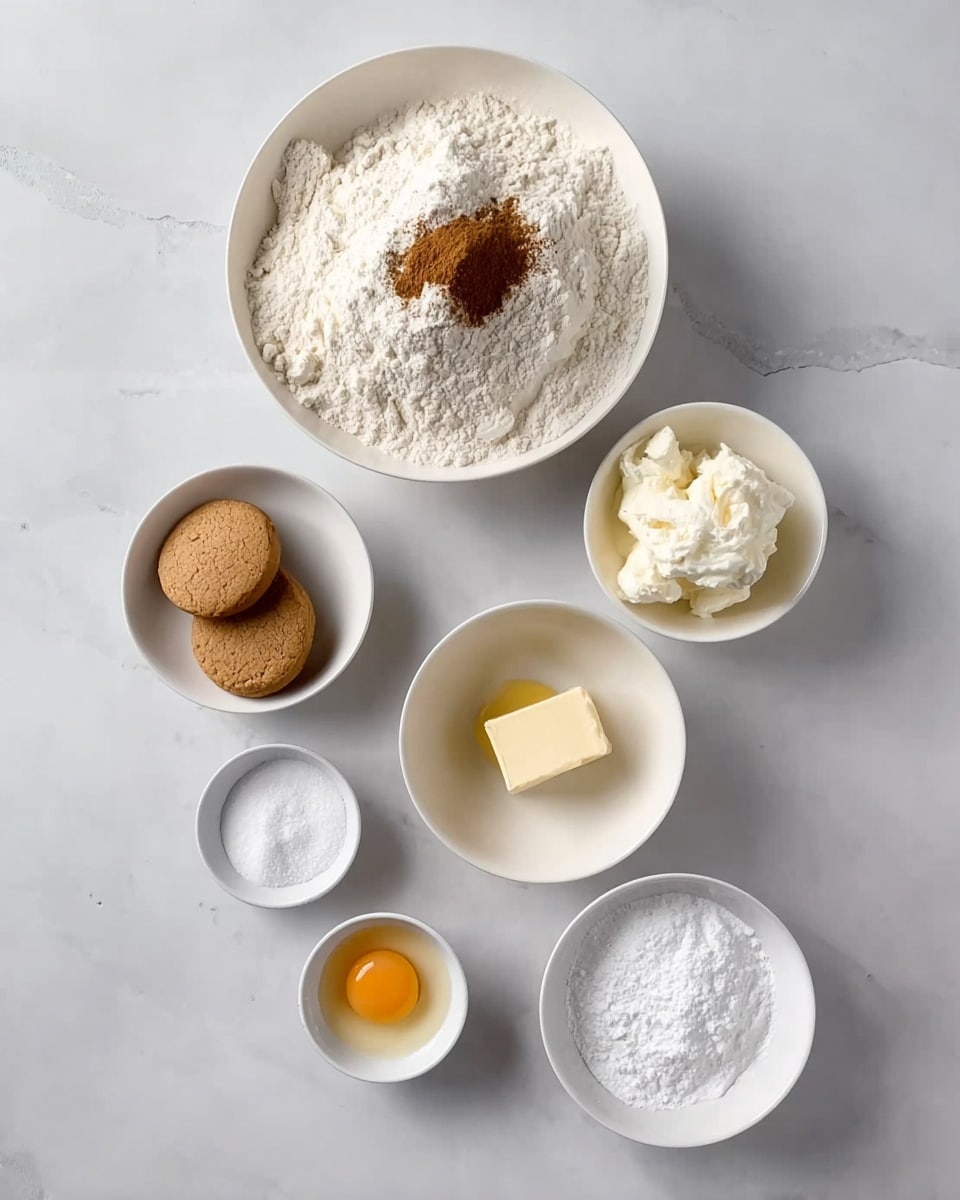 The image shows six small white bowls arranged on a white marbled surface. The largest bowl at the center contains a heap of white flour with a small pile of brown cinnamon powder on top. Above it, a smaller bowl holds soft cream cheese or a similar white creamy ingredient. On the right side near the flour bowl, another small white bowl is filled with white powdered sugar. Below, a medium bowl contains a yellowish solid, likely butter. To the left of that, a small white bowl has a raw egg yolk with clear egg white. Another small bowl on the left holds two light brown round cookies and white sugar. Lastly, a small bowl at the bottom has white sugar mixed with a small amount of brown spice, possibly cinnamon. Photo taken with an iphone --ar 4:5 --v 7