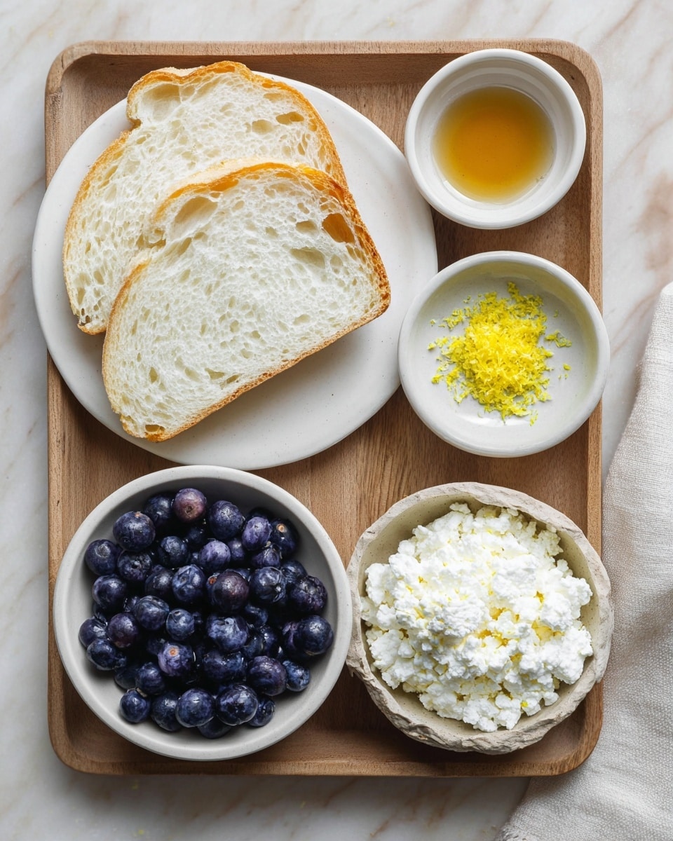 The image shows a wooden tray on a white marbled surface holding four small white bowls and a white plate. On the white plate to the top left, there are two slices of white bread with a soft, airy texture and golden crust. To the right of the plate, a small white bowl holds a small amount of clear honey with a glossy shine. Below it, another small bowl contains bright yellow lemon zest finely grated. At the bottom left, a white bowl is full of fresh, plump blueberries, deep blue in color with a slight shine. At the bottom right, a rough-edged white bowl holds a white, crumbly soft cheese with a slightly grainy texture. photo taken with an iphone --ar 4:5 --v 7