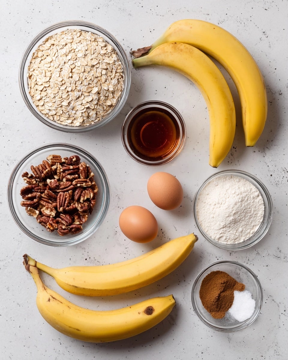 A flat lay of ingredients on a white marbled surface shows three ripe yellow bananas with small brown spots placed slightly overlapping in the center. Surrounding them are six clear glass bowls: one filled with light beige rolled oats at top left, one with dark amber liquid syrup at top center, one with white flour at top right, one with chopped brown pecans at bottom left, and a small one at bottom right containing a mix of brown cinnamon powder, white baking powder, and salt. Two brown eggs lie side by side near the bottom center, close to the bananas. The scene is brightly lit and arranged neatly. Photo taken with an iphone --ar 4:5 --v 7