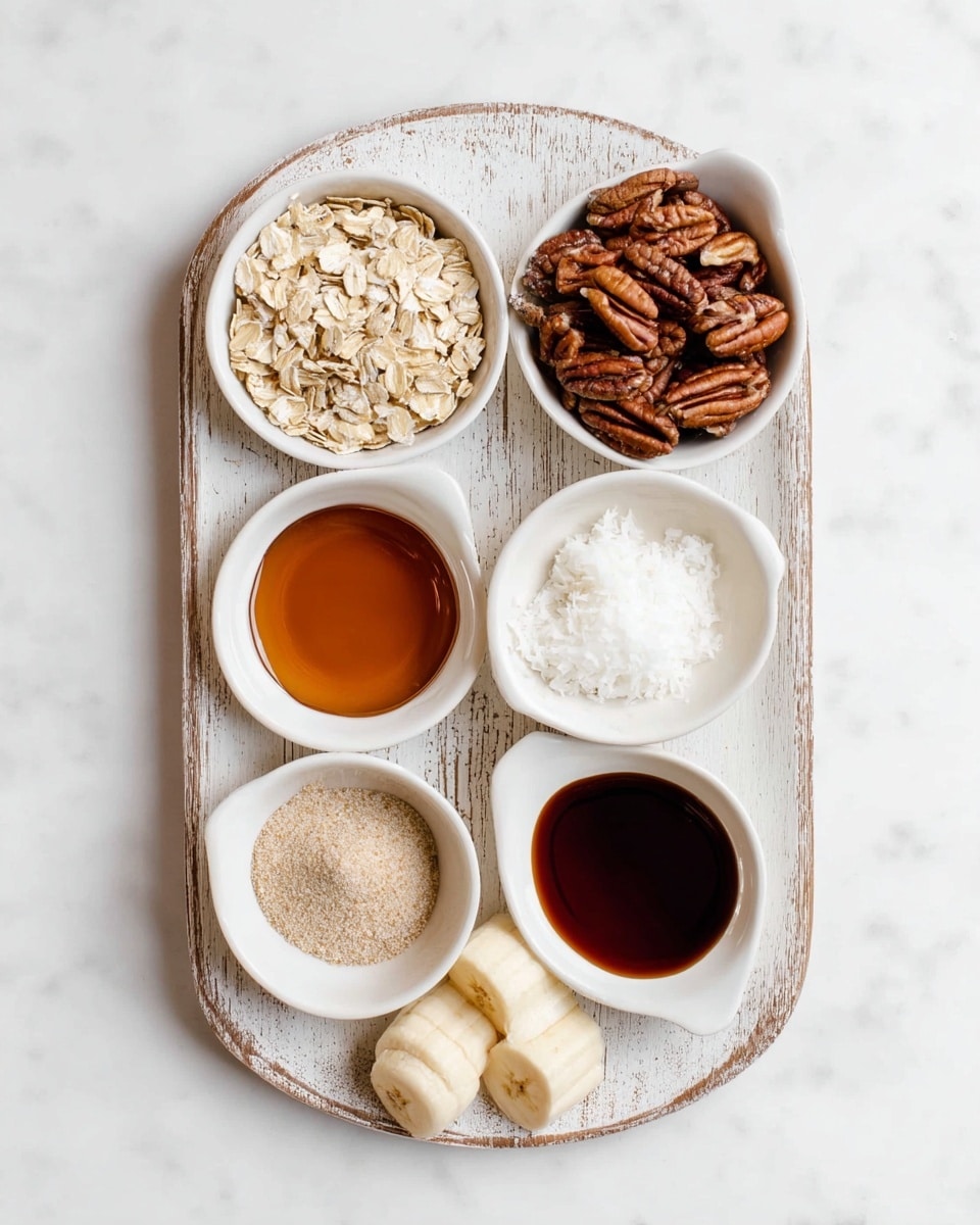 A white rustic wooden tray holds seven small white bowls arranged in a rough oval shape; the top left bowl is filled with light beige rolled oats showing a dry, flaky texture, the top right bowl contains dark brown pecan nuts with ridged surfaces, the middle center bowl holds amber-colored syrup with a smooth surface, the middle right bowl is filled with white fluffy coconut oil, the lower left bowl contains a fine light brown powder, the bottom center bowl has a dark syrup with a glossy surface, and the lower right bowl holds two pieces of peeled banana with a soft, creamy texture. The tray is set on a white marbled surface. Photo taken with an iphone --ar 4:5 --v 7