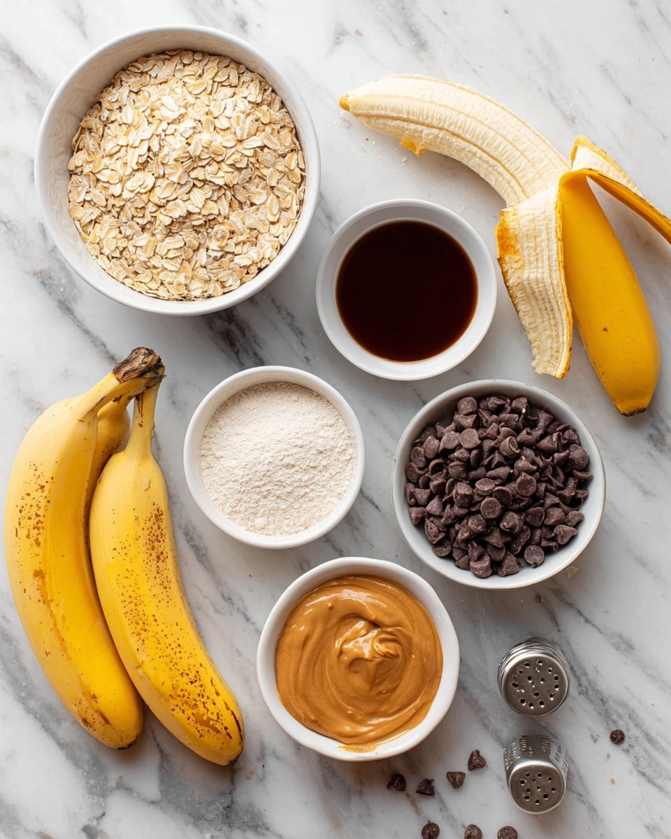 The image shows several ingredients laid out on a white marbled surface. In the upper left corner, there is a white bowl filled with light brown oats. Next to it, on the right, is a peeled banana with its yellow peel folded back. Below the banana, there is a small white bowl with dark brown liquid, and next to it is another small white bowl filled with white powder. In the lower center, a white bowl contains tan-colored peanut butter. To the bottom right, a white bowl holds dark brown chocolate chips. Two ripe yellow bananas with some brown spots are placed on the left side, and a salt shaker is visible near the right edge. A few scattered chocolate chips are spread across the surface. Photo taken with an iphone --ar 4:5 --v 7