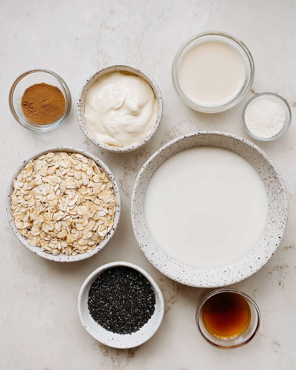 The image shows seven small white dishes arranged on a white marbled surface. Starting from the right, there is a large white bowl filled with a smooth, white liquid, likely milk. Above it is a white speckled bowl containing a thick, creamy white substance. Below that, to the left, is a small white bowl filled with rolled oats, light tan and flaky. Next to it on the left is another white bowl with tiny black seeds, almost filling the bowl. Above it are two glass bowls containing off-white liquids, one slightly darker than the other. Below these two is a small white dish holding brown powder, likely a spice, and next to it a small glass bowl with a dark brown liquid, possibly syrup or vanilla extract. All bowls have different textures and colors that stand out against the white marbled background. photo taken with an iphone --ar 4:5 --v 7
