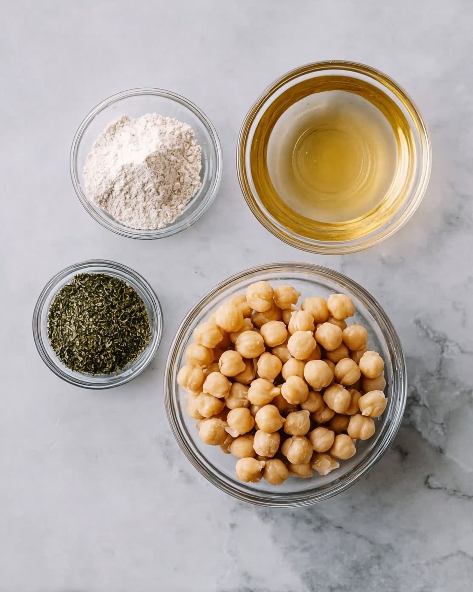 The image shows four small clear glass bowls placed on a white marbled surface. The largest bowl, in the center, is filled with round, beige chickpeas with a smooth texture. Above it to the right is a bowl containing light golden liquid with a shiny surface. Above it to the left is a bowl filled with white powder, and below it to the left is a bowl with finely ground dark green herbs. The bowls are arranged in a casual square pattern. photo taken with an iphone --ar 4:5 --v 7