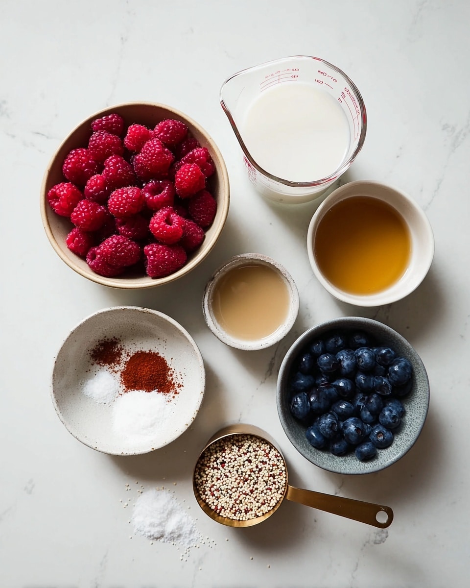 The image shows several small bowls and a glass measuring cup arranged on a white marbled surface. There is a beige bowl filled with bright red raspberries on the left. Next to it is a clear glass measuring cup with white liquid. To the right, two white bowls hold light brown and golden liquids. Below these is a small, round, white bowl with a reddish-brown powder and a smaller white bowl with white salt. A gray bowl full of dark blue blueberries sits near the bottom right, with a few more scattered outside the bowl next to a brass measuring cup filled with small white and red grains. The colors are soft and natural, with a clean and organized look. photo taken with an iphone --ar 4:5 --v 7
