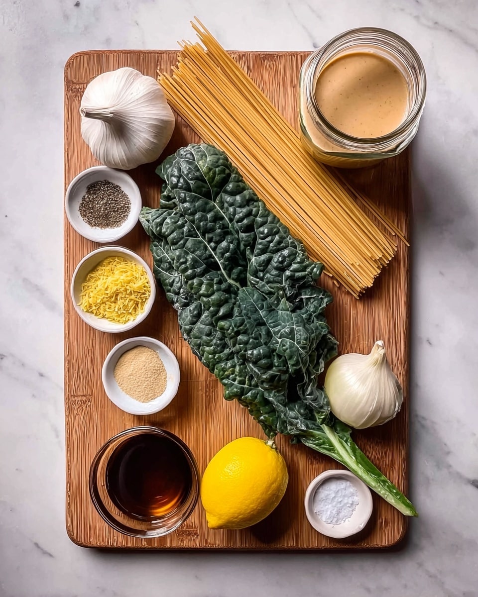 The image shows a wooden cutting board placed on a white marbled surface, holding several fresh ingredients neatly arranged. There is a bulb of garlic at the top left corner, three long uncooked spaghetti sticks lying diagonally near the top right, and a large dark green kale leaf placed vertically near the center. Next to the kale leaf on the left side, there is a whole onion, a small bowl filled with yellow zest, and a small bowl of light yellow powder. Near the bottom left corner, a small glass bowl contains a dark amber liquid. A whole yellow lemon rests at the bottom center. A small white dish with salt and black pepper is also visible near the lemon. At the top right corner, there is a glass jar filled with a creamy beige sauce. photo taken with an iphone --ar 4:5 --v 7