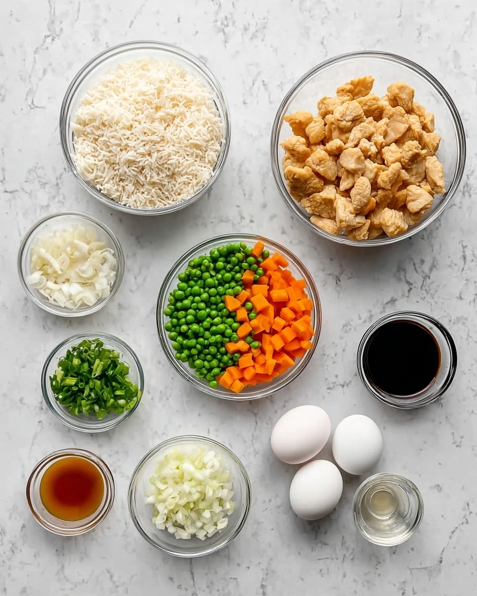 Seven clear glass bowls are arranged on a white marbled surface. The largest bowl at the top left is filled with white cooked rice. To the top right is another large bowl filled with light brown chicken pieces. In the center is a medium bowl holding a mix of bright green peas and orange carrot cubes. To the right of this bowl is a smaller bowl with white chopped onions. At the bottom left are three small bowls, the first with chopped green onions, the second with a dark amber liquid, and the third with two white whole eggs. Near the bottom right is a small bowl with a dark soy sauce-like liquid, and next to it is a tiny bowl with a clear light liquid. photo taken with an iphone --ar 4:5 --v 7
