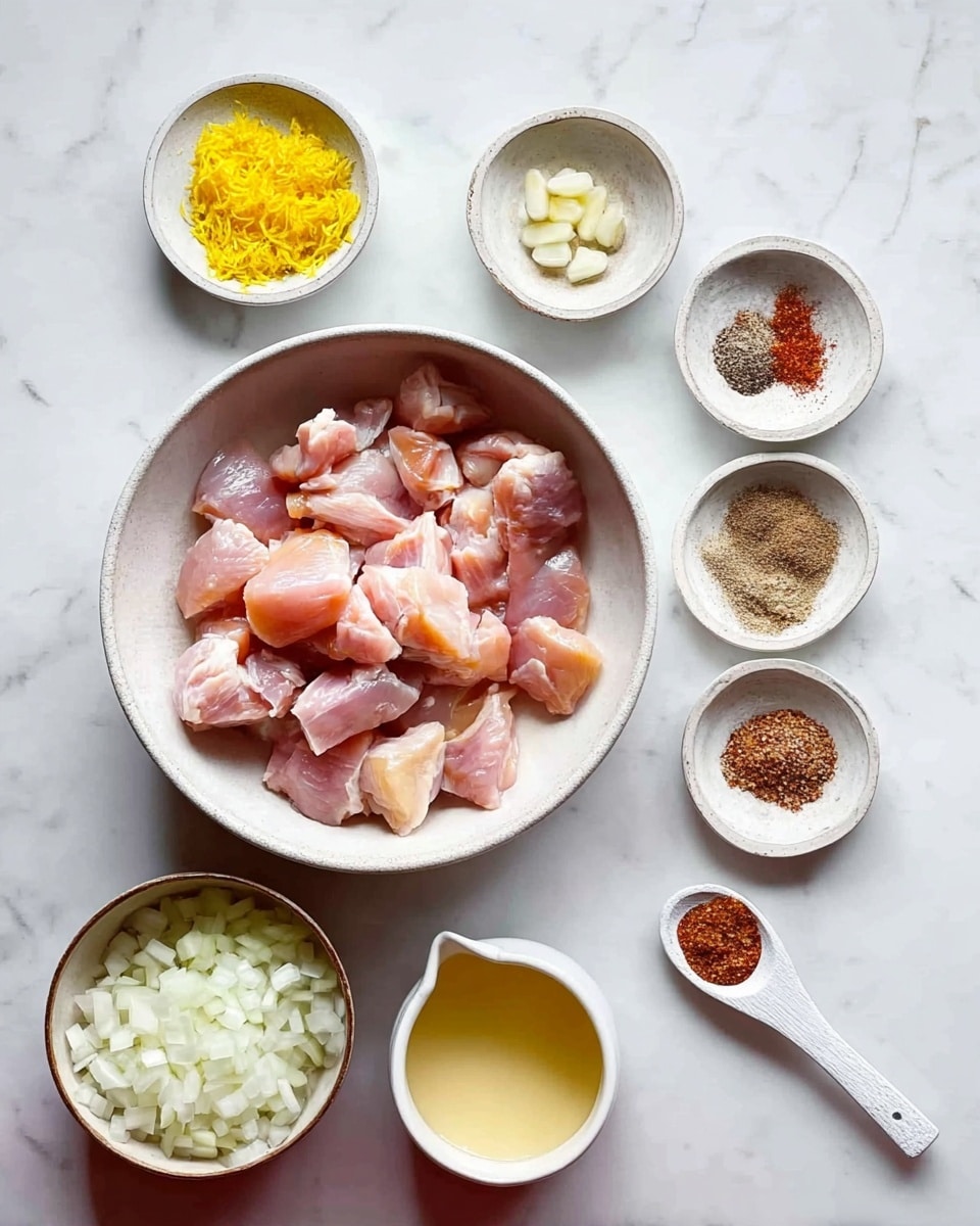 The image shows a white bowl in the center filled with raw light pink chicken pieces. Below to the left, there is a small white bowl full of chopped white onions. Around the bowls, there are six small white dishes and a white wooden spoon, each holding different ingredients: bright yellow lemon zest in a small bowl at the top left, a small bowl with salt and red seasoning at the top right, a small bowl with brown powder below and to the right of the lemon zest, a small bowl with a creamy liquid below the bowl of chicken, a very light yellow liquid in a small cup to the left of the creamy liquid, a small bowl filled with finely chopped garlic below the powder, and a white wooden spoon on the right holding reddish-brown ground spices. All items are placed on a white marbled surface. photo taken with an iphone --ar 4:5 --v 7